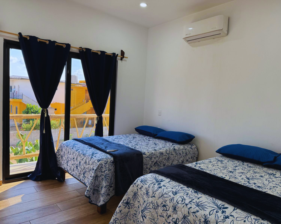 Habitación familiar con camas matrimoniales en renta vacacional de Punta Pérula